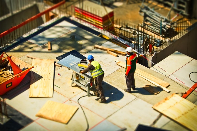 Construction Site in Pennsylvania with man working on roof